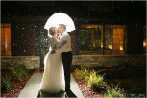 Couple kiss outside in the rain