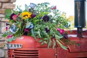 flower display on top of vintage tractor
